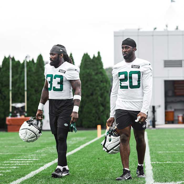 Jets' running backs Dalvin Cook (33) and Breece Hall (20) in Florham Park